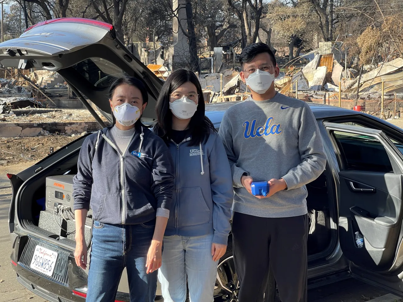 Yifang Zhu, Yuan Yao and Haoxuan Chen during post-fire fieldwork